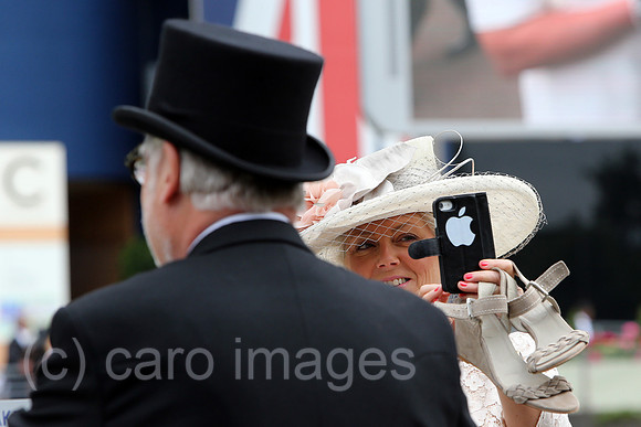 Royal Ascot, Fashion, woman with hat and man with top hat at the racecourse