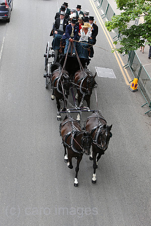 Royal Ascot, People in a carriage on their way to the racecourse on Ascot High Street