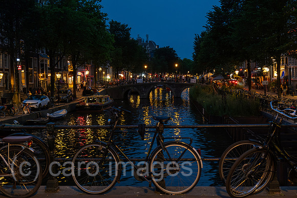 Netherlands, Amsterdam - bridge with bicycles on it over a canal in the old town (city centre)