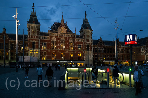 Netherlands, Amsterdam - Front of the Centraal Station (main station), in front an escalator to the underground