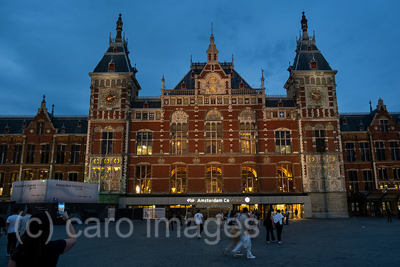 Netherlands, Amsterdam - Front of Centraal Station (main station), with an escalator to the underground at the front